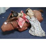 A carved Vietnamese pig and two Chinese hand puppets