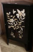 An ebonised corner cabinet with bone birds and flowers in relief on door, H.100cm