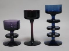 Stennet-Wilson for Wedgwood. A blue glass candlestick and two similar in amethyst glass