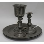 Two early 19th century pewter chargers with London touchmarks, a pewter goblet and a pair of
