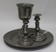 Two early 19th century pewter chargers with London touchmarks, a pewter goblet and a pair of