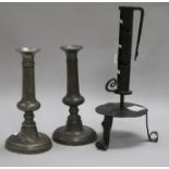 An 18th century French wrought iron adjustable candlestick and a pair of pewter candlesticks