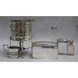 A silver plated bottle coaster, on reeded legs with paw feet, a plated biscuit box and three