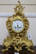 A Louis XV style gilt brass eight day mantel clock