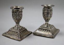 A pair of Victorian silver dwarf candlesticks, Hawksworth, Eyre & Co, Sheffield, 1876, 11cm.