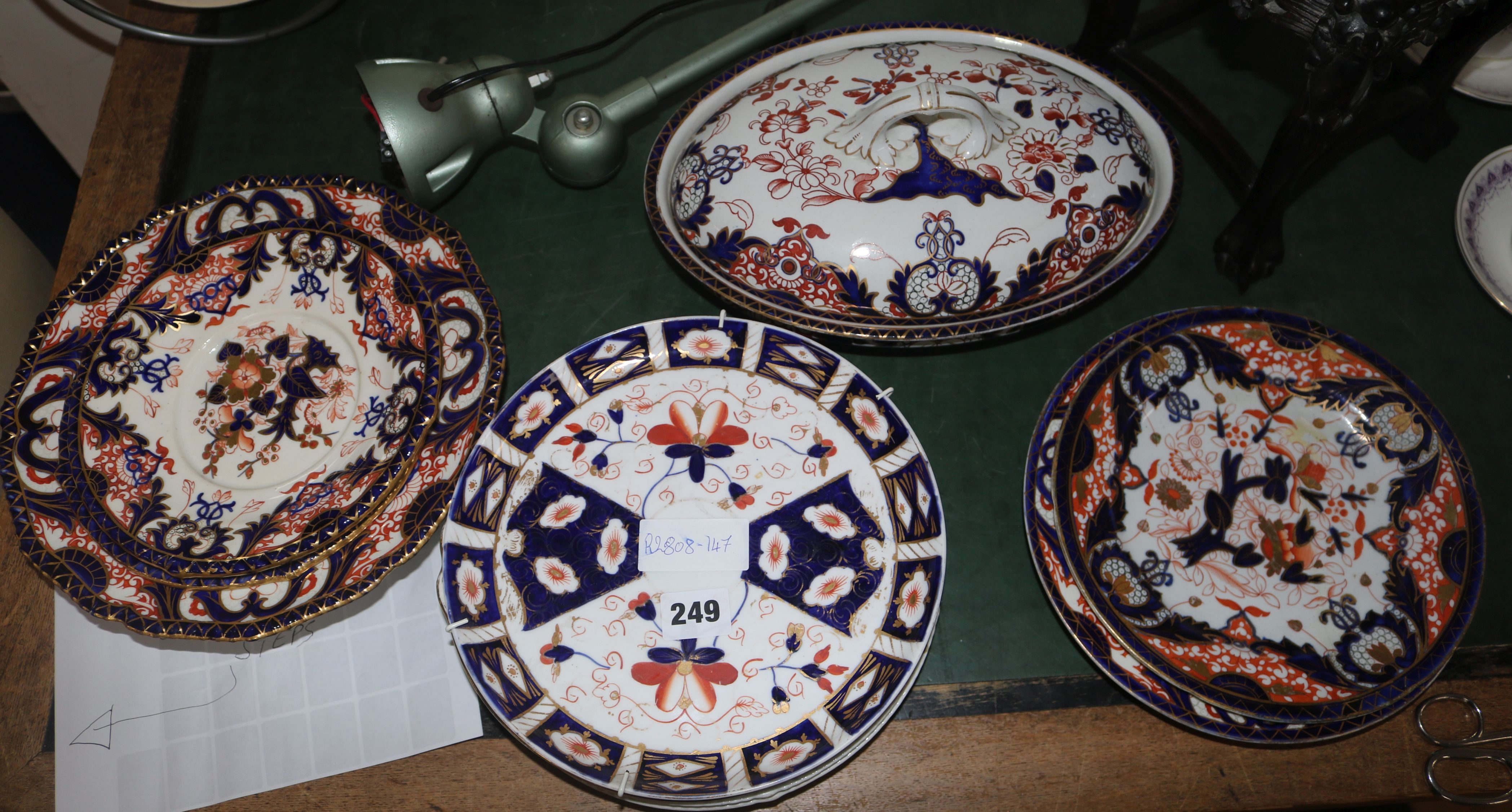 A quantity of Derby Imari pattern plates, dishes and tureen