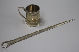 A George III silver meat skewer, London 1800 and a silver Christening mug of cylindrical reeded