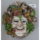 An Austrian tinglazed terracotta Bacchus mask