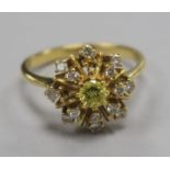 A fancy yellow and colourless diamond star-burst cluster ring, yellow metal shank (two small
