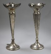 A matched pair of early 20th century silver spill vases, 24cm.