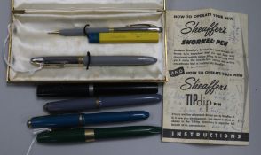 A 'Sheaffer's Snorkel' White Dot pen and pencil set, cased, three other Sheaffer and an Onoto pen