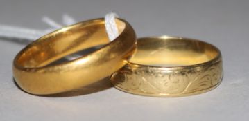 One 22ct gold band and one 18ct gold band, 9.2 grams and 5.5 grams respectively.