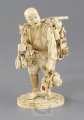 A Japanese inlaid ivory okimono of a street vendor, Meiji period, the figure supporting wares