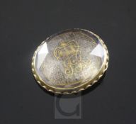 An early 18th century gold mounted Stuart crystal momento mori slide, with gold wirework initials "