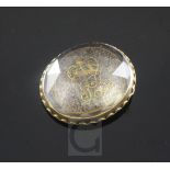 An early 18th century gold mounted Stuart crystal momento mori slide, with gold wirework initials "