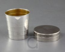 An Edwardian silver travelling collapsible stirrup cup with box and cover, by Griffiths & Singleton,