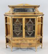 Lamb of Manchester. A Victorian Aesthetic movement ebony strung golden oak bookcase, the two doors