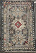 A Shirvan ivory ground rug, c.1880, with three central star motifs in a field of geometric shapes