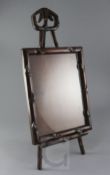 A Chinese hongmu picture frame and easel, c.1900, the upright carved as shoots of bamboo, the