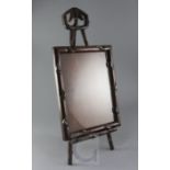 A Chinese hongmu picture frame and easel, c.1900, the upright carved as shoots of bamboo, the