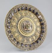 A Tibetan gilt copper and gem set altar dish, 19th century, set with turquoise, coral and colour