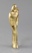 A gilded bronze of a Madonna and Child in the Cubist style, inset in the metal of the base is the