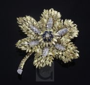 A gold, sapphire and diamond set flowerhead brooch, gross 33.6 grams, 60mm.