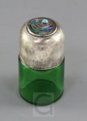 An Edwardian Art Nouveau Liberty & Co. Cymric silver and enamel mounted green glass salts bottle