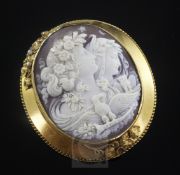 A Victorian gold mounted oval cameo brooch, carved with Night and Day, eagle and owl, the mount with