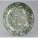 A rare Chinese enamelled biscuit (susancai) 'nine horses' dish, Kangxi period (1662-1722), the