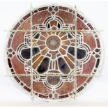 A set of eleven 19th century stained glass roundels, mostly foliate designs, one depicting a dove