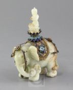 A Chinese celadon jade and filigree work group of Buddha riding an elephant, early 20th century, the