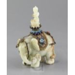 A Chinese celadon jade and filigree work group of Buddha riding an elephant, early 20th century, the