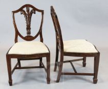 A set of twelve Hepplewhite style mahogany dining chairs, with Prince of Wales feather backs and