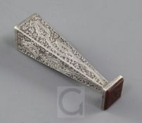 A Persian white metal desk seal, engraved and chased with boteh and foliage, inset with an