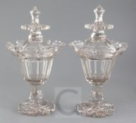 A pair of cut glass jars and covers, mid 19th century, with lotus petal cut borders, hexagonal