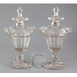 A pair of cut glass jars and covers, mid 19th century, with lotus petal cut borders, hexagonal