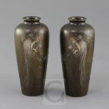 A pair of Japanese bronze and mixed metal baluster vases, Meiji period, each decorated with a