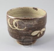 Manner of Shoji Hamada. A Studio pottery cup, with resist decoration of interlinked rings and leaf