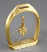 A Jaeger Le Coultre gilt metal desk timepiece, modelled as a stirrup, no.3215005, 6in.