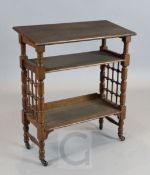 Attributed to Leonard Wyburd. A Liberty & Co oak book table, with slanted top and two tiers, ex Fine