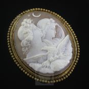 A Victorian gold mounted oval cameo brooch, carved with Night and Day with an eagle in the
