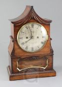 Rigby of Charing Cross. A William IV brass inset rosewood bracket clock, with pagoda shaped case,