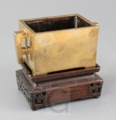 A good Chinese bronze rectangular censer, fangding, 18th century, with a pair of fretwork handles,