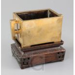 A good Chinese bronze rectangular censer, fangding, 18th century, with a pair of fretwork handles,