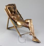 Desmond Fountain (Bermudan, b.1946). A bronze figure of a nude young woman reclining in a deck