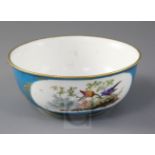 A Sevres style bleu celeste ornithological bowl, possibly a later decorated Sevres blank, diameter