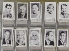 An album containing a large quantity of mixed part sets of cigarette cards, various themes, many