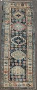 An Isfaphan blue ground carpet, with field of scrolling foliage and three row border, 15ft 10in by