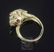 A gold, diamond and gem set lion's head ring, size Q.